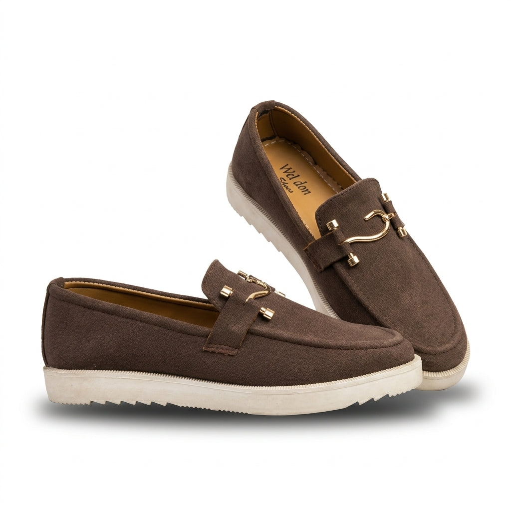 Dark chocolate suede horsebit sneaker loafer pair studio shot white background showing gold horsebit hardware tan insole and ribbed white cupsole