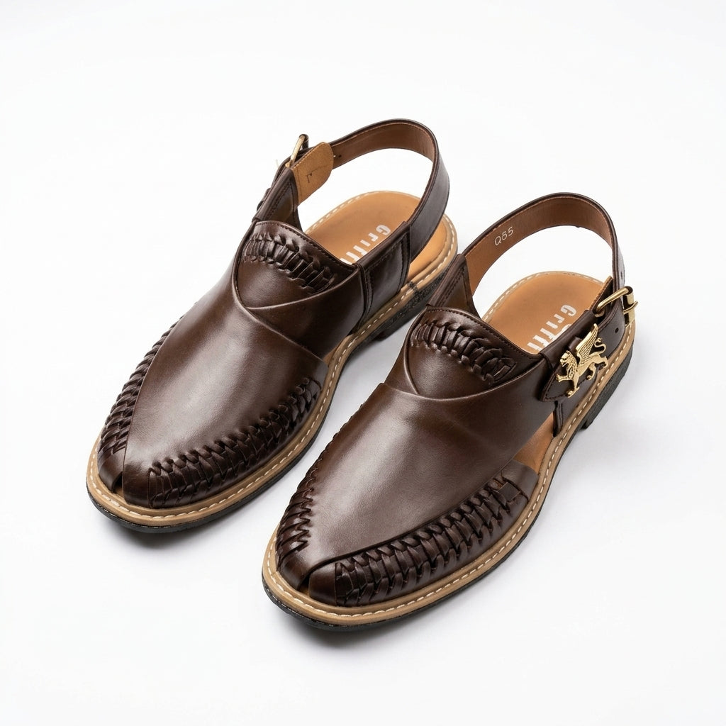 Dark brown leather Peshawari woven slingback sandal pair studio shot white background showing gold lion charm on buckle strap