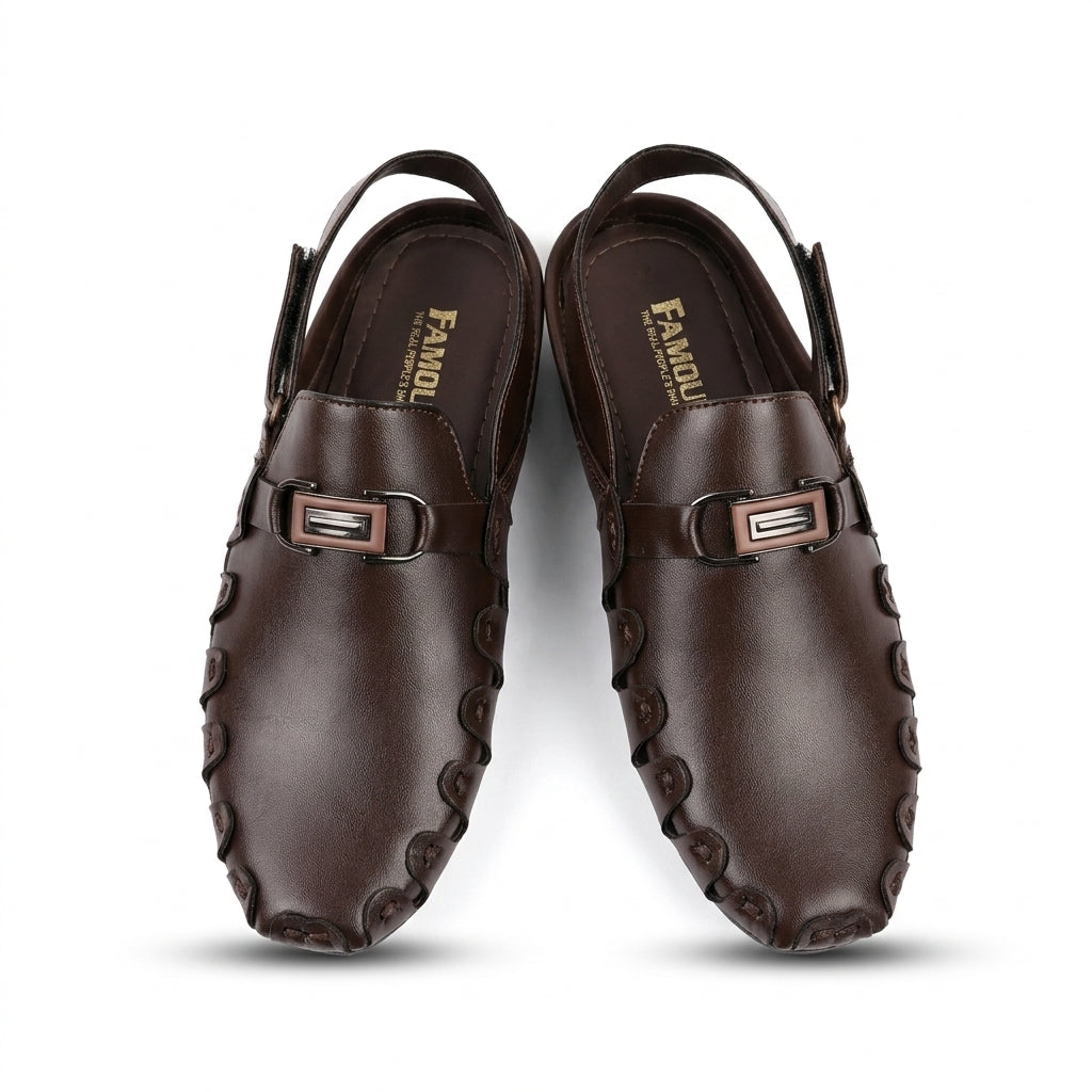 Dark brown leather loafer-style slingback chappal pair top-down studio shot white background showing gunmetal buckle bar and whipstitch moccasin edge