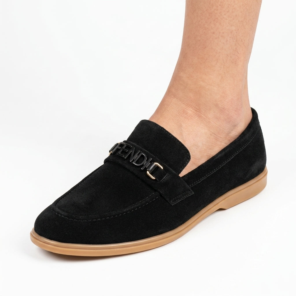 Black suede logo loafer worn by man