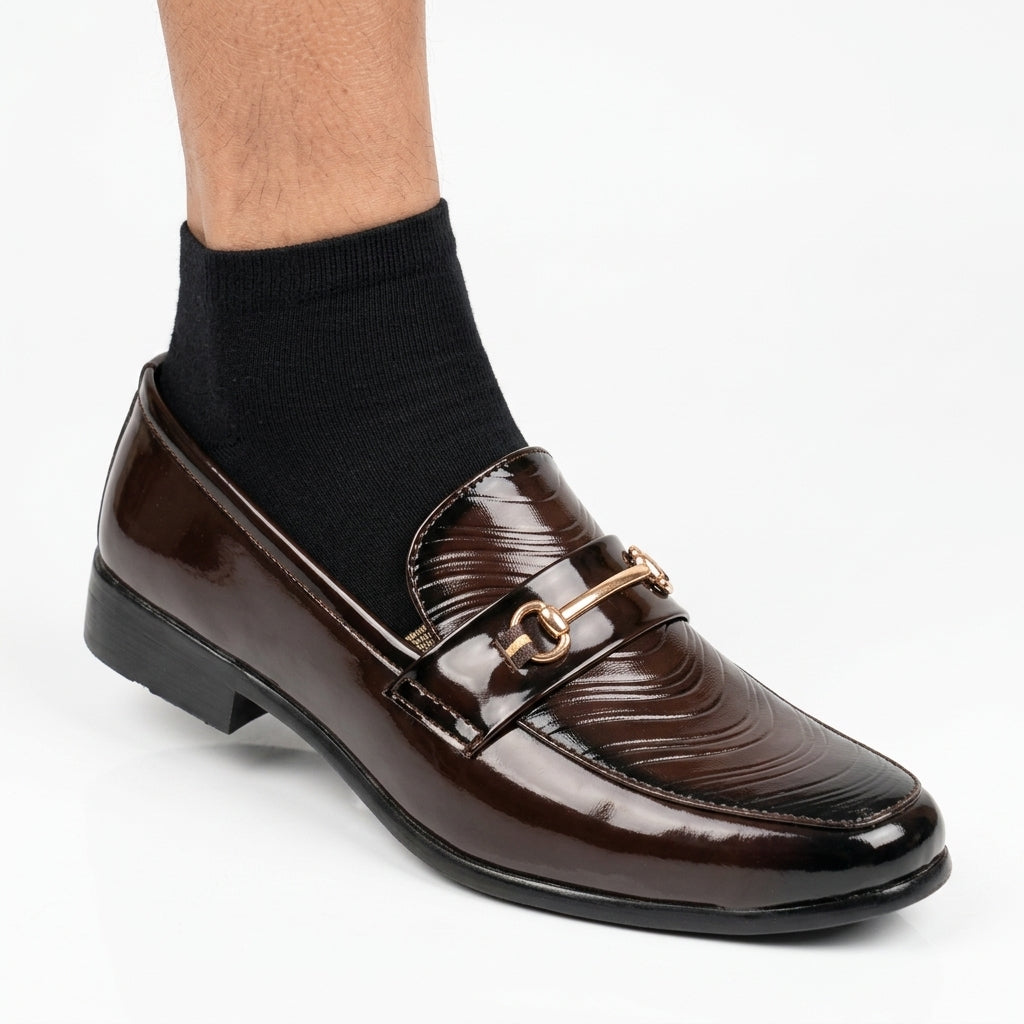 Brown croc-embossed tassel loafer with gold chain hardware and black cap toe
