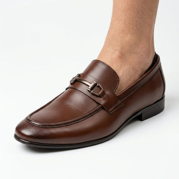 Dark brown patent leather double-buckle loafer with silver rivets
