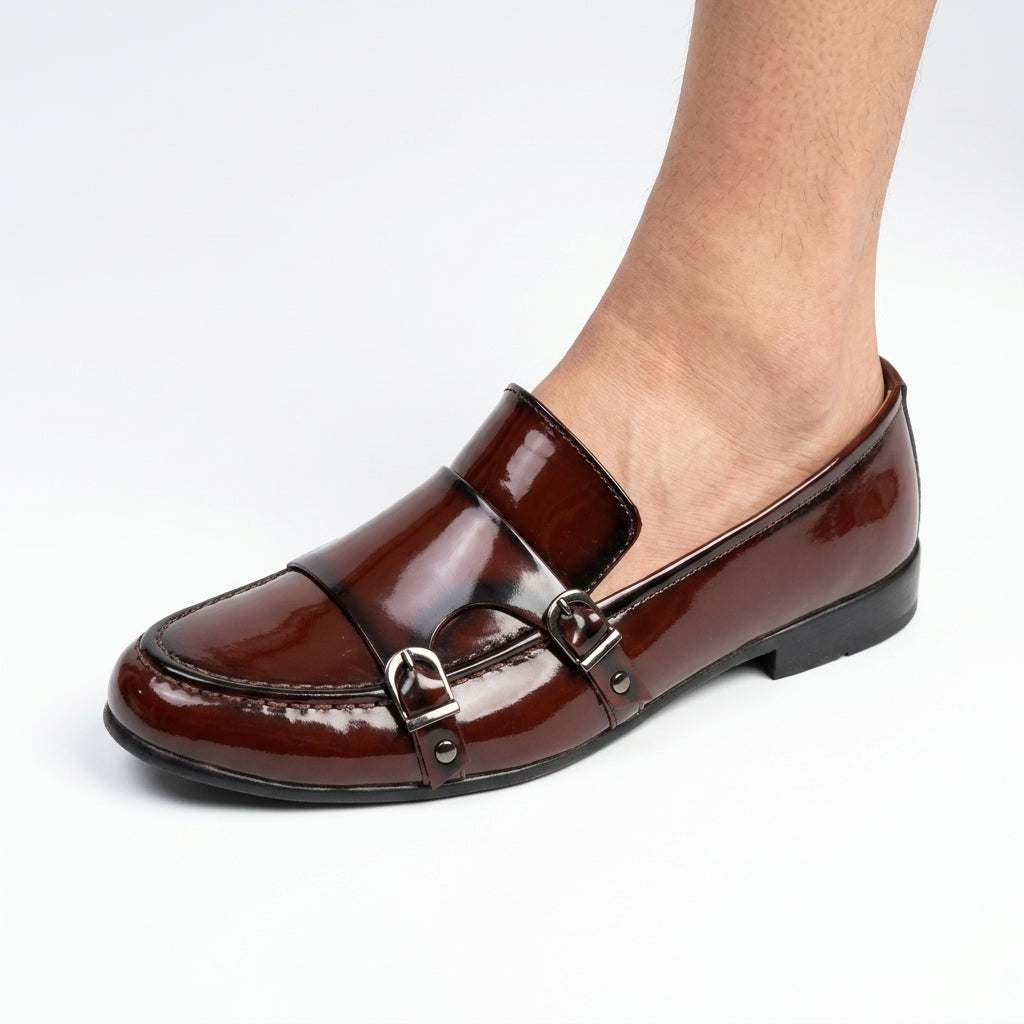 Brown leather horsebit loafer with gunmetal hardware side view