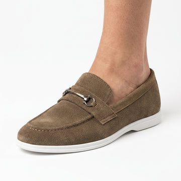 Brown suede horsebit loafer with white sole worn by man