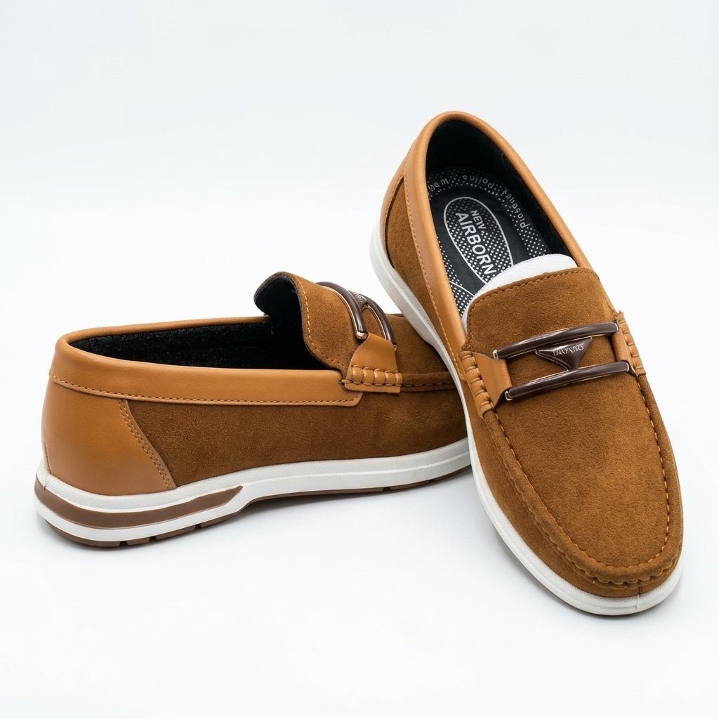 Tan nubuck two-tone double-bar bit loafer pair studio shot white background showing gunmetal double-bar hardware moccasin stitching and white cupsole with brown stripe