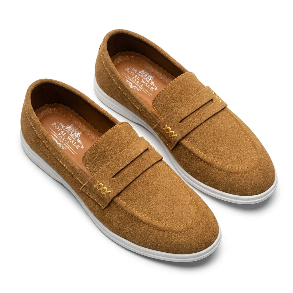 Camel suede gold cross-stitch penny loafer pair studio shot white background showing gold XXX cross-stitch accent moccasin stitching and white cupsole Royal Walk insole visible